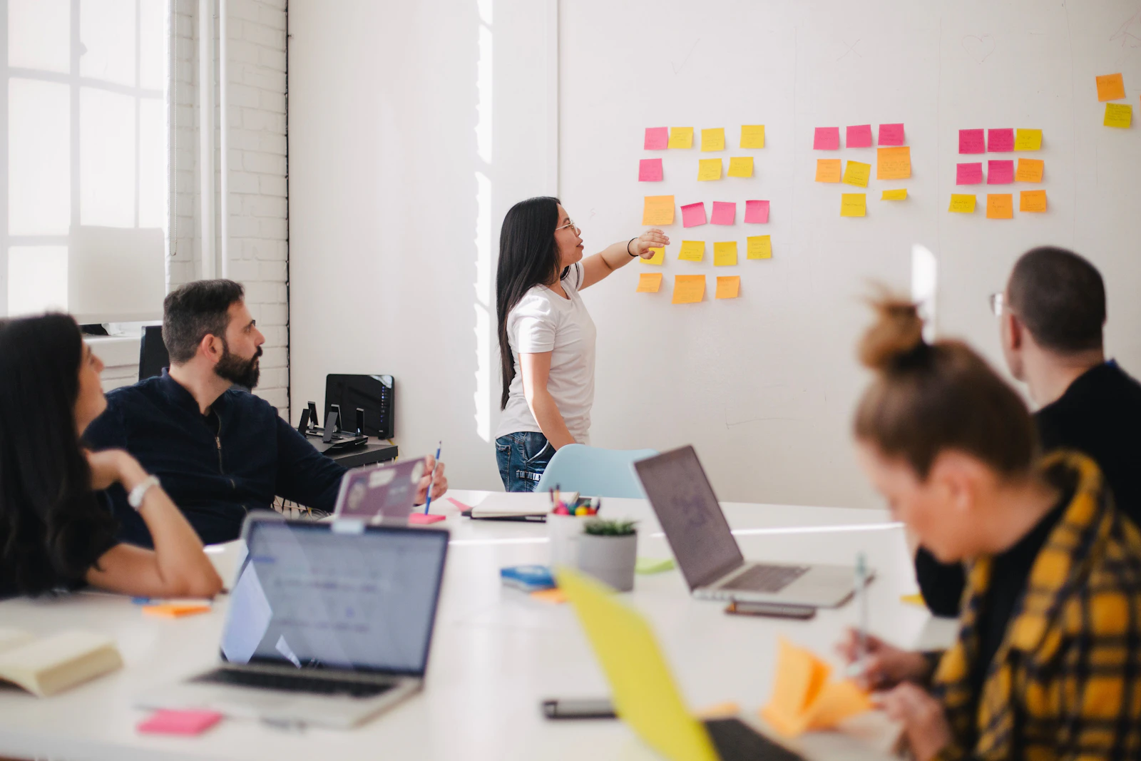 Business consulting team reviewing data and charts